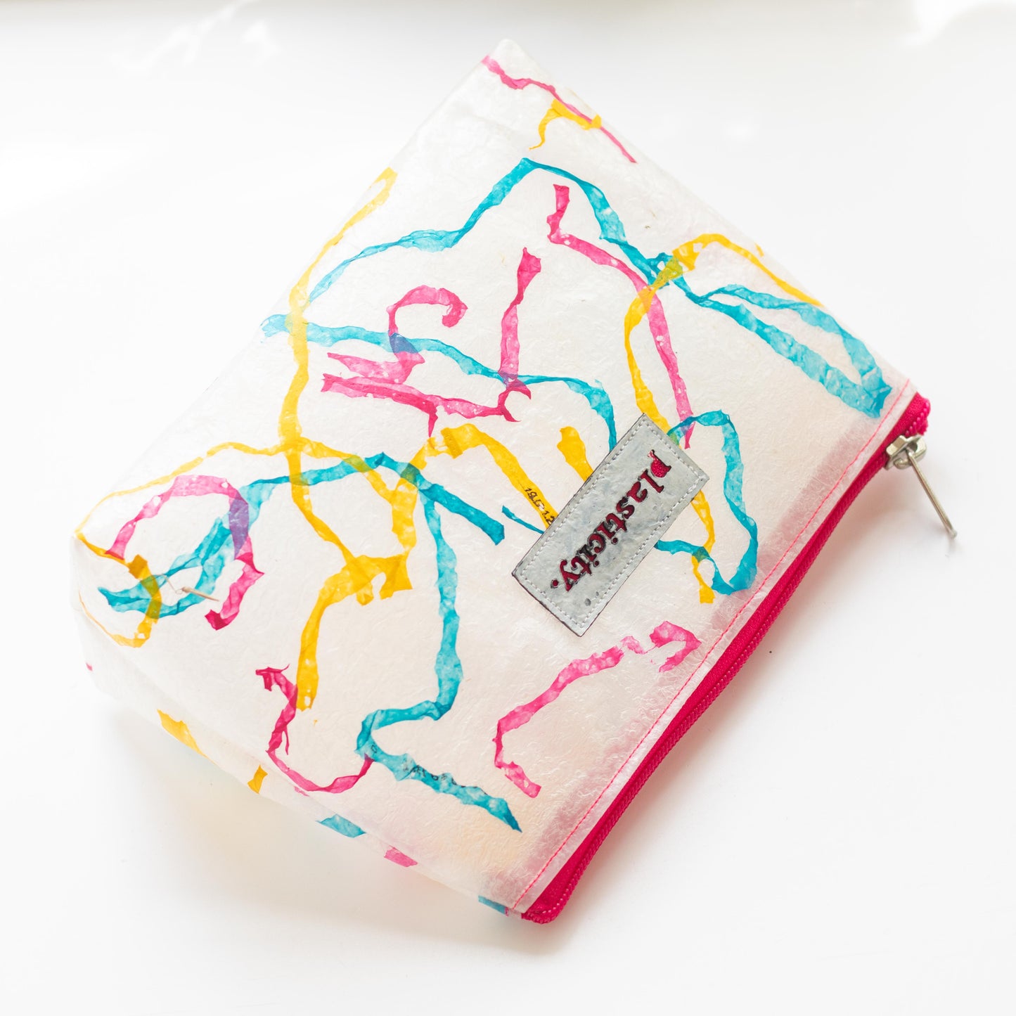 Water-resistant upcycled plastic make-up bag | Colour pop squiggle